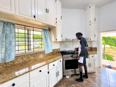 Chef preparing food in the Grand Pavilion kitchen at Da Villa Juanita