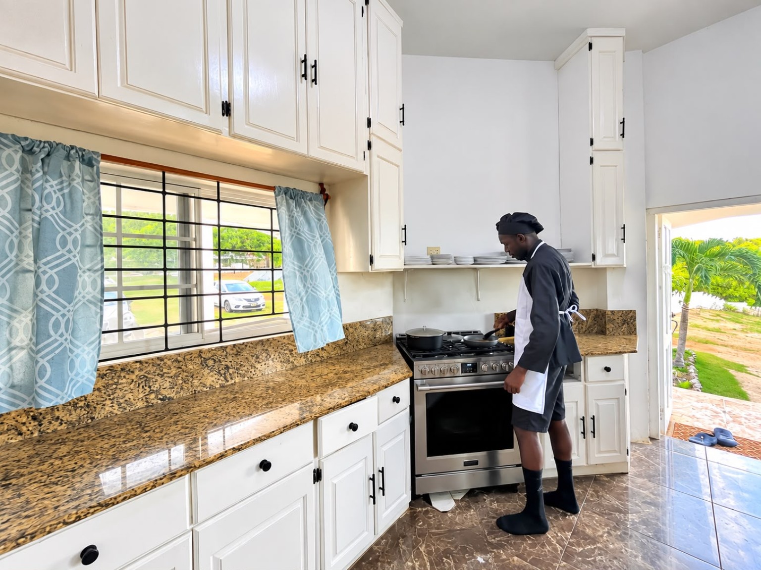 Chef preparing food in the Grand Pavilion kitchen at Da Villa Juanita