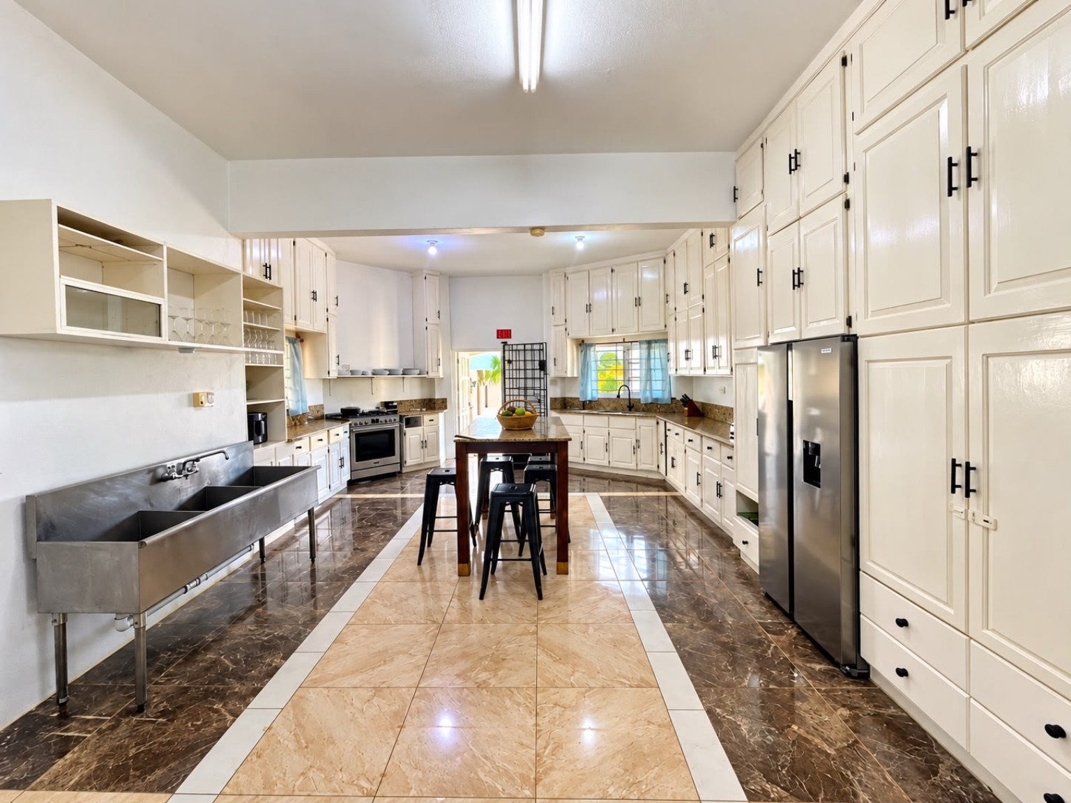 Bright wide view of the Grand Pavilion kitchen at Da Villa Juanita