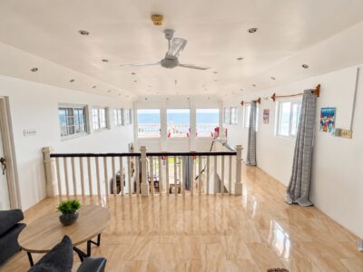 Grand Pavilion upper landing lounge with ocean view at Da Villa Juanita