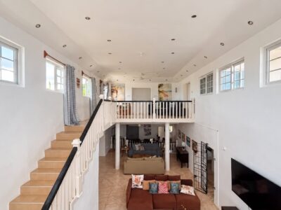 Grand Pavilion upper level open lounge overlooking the main living area at Da Villa Juanita